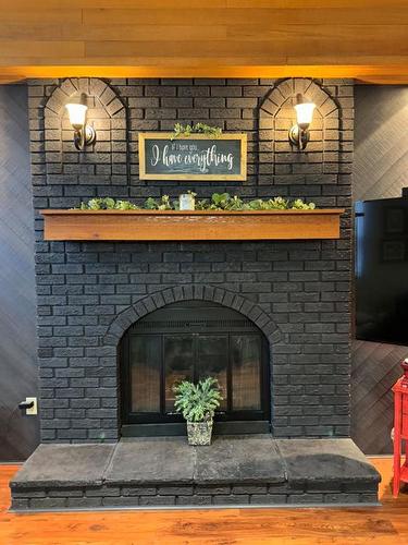 7213 96 Street, Peace River, AB - Indoor Photo Showing Living Room With Fireplace