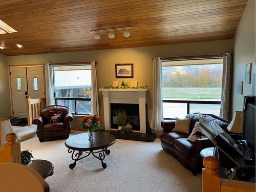 7213 96 Street, Peace River, AB - Indoor Photo Showing Living Room With Fireplace