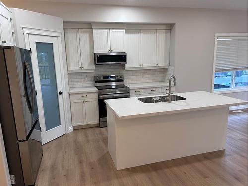 63 Pinnacle Lake Drive, Grande Prairie, AB - Indoor Photo Showing Kitchen With Double Sink