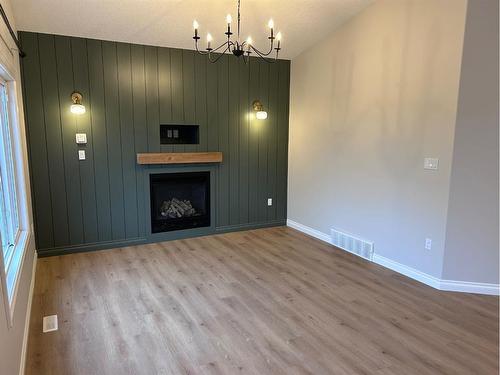 63 Pinnacle Lake Drive, Grande Prairie, AB - Indoor Photo Showing Living Room With Fireplace