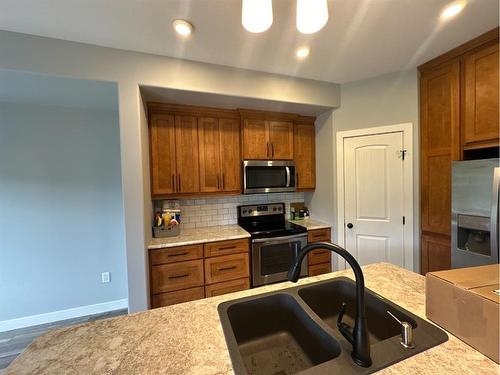 11321 & 11323 91 Street, Peace River, AB - Indoor Photo Showing Kitchen With Double Sink