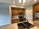 11321 & 11323 91 Street, Peace River, AB  - Indoor Photo Showing Kitchen With Double Sink 