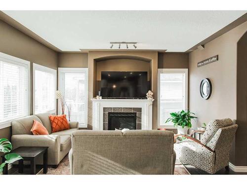 9305 Lakeshore Court, Grande Prairie, AB - Indoor Photo Showing Living Room With Fireplace