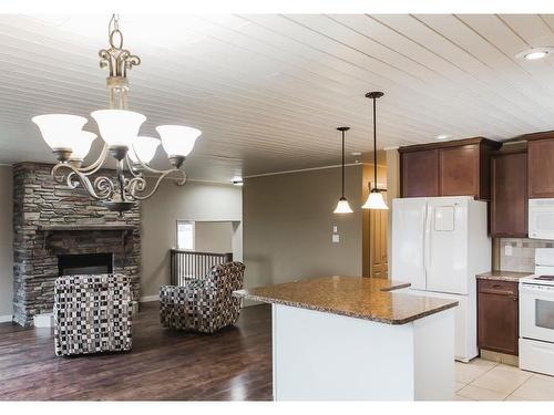 #77, 710072 Highway 40, Rural Grande Prairie No. 1, County Of, AB - Indoor Photo Showing Kitchen With Fireplace