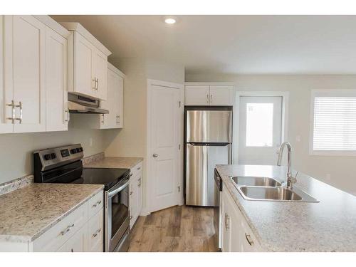 9510 114 Avenue, Clairmont, AB - Indoor Photo Showing Kitchen With Double Sink