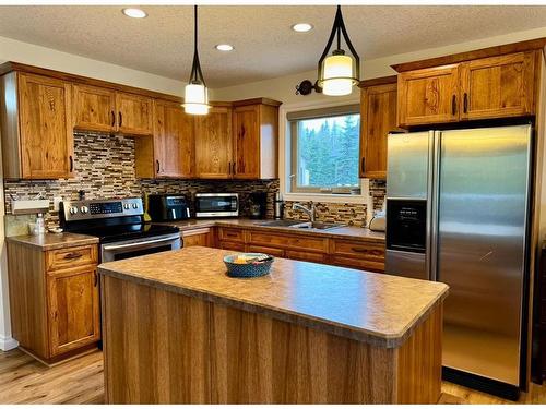 125 Monias Drive, Rural Big Lakes County, AB - Indoor Photo Showing Kitchen With Double Sink