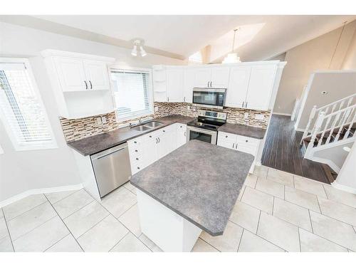 9326 Wedgewood Drive, Wedgewood, AB - Indoor Photo Showing Kitchen With Stainless Steel Kitchen With Double Sink