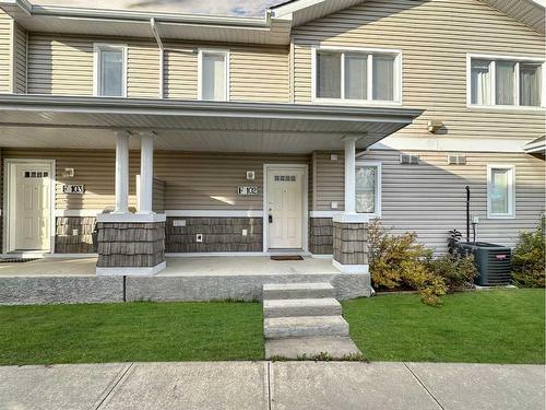 102F-8640 103 Avenue, Grande Prairie, AB - Outdoor With Deck Patio Veranda With Facade