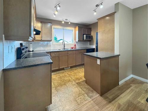 102F-8640 103 Avenue, Grande Prairie, AB - Indoor Photo Showing Kitchen With Double Sink