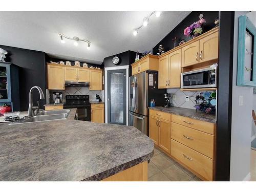 8810 113 Avenue, Grande Prairie, AB - Indoor Photo Showing Kitchen With Double Sink