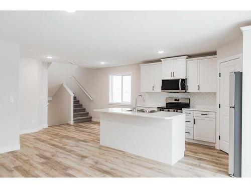 11445 95 Street, Clairmont, AB - Indoor Photo Showing Kitchen With Double Sink