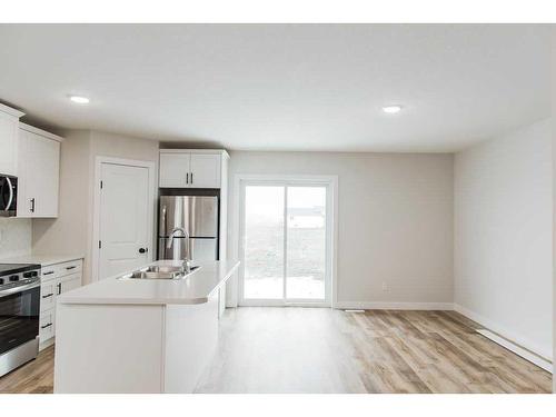 11445 95 Street, Clairmont, AB - Indoor Photo Showing Kitchen With Stainless Steel Kitchen With Double Sink With Upgraded Kitchen