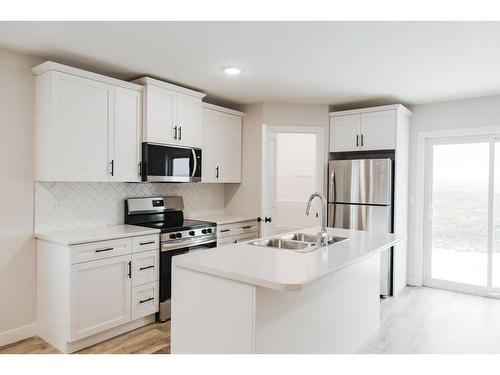 11445 95 Street, Clairmont, AB - Indoor Photo Showing Kitchen With Stainless Steel Kitchen With Double Sink With Upgraded Kitchen