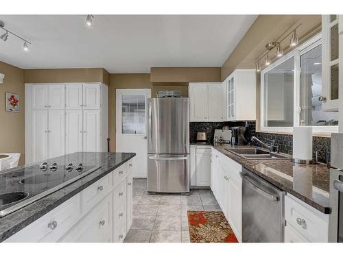 9906 105 Avenue, Grande Prairie, AB - Indoor Photo Showing Kitchen With Double Sink