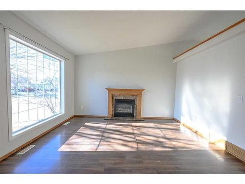 8942 64 Avenue, Grande Prairie, AB - Indoor Photo Showing Living Room With Fireplace