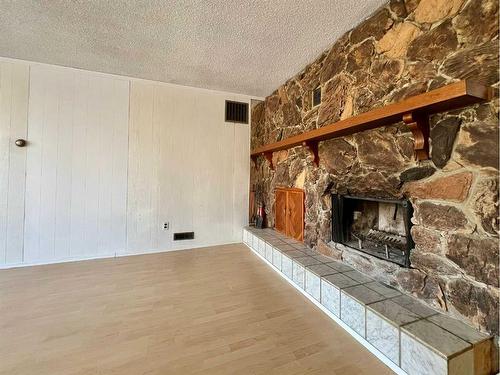 5015 46 Street, Valleyview, AB - Indoor Photo Showing Living Room With Fireplace