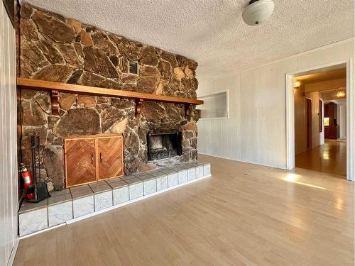 5015 46 Street, Valleyview, AB - Indoor Photo Showing Living Room With Fireplace