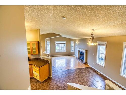 7141 114A Street, Grande Prairie, AB - Indoor Photo Showing Other Room With Fireplace