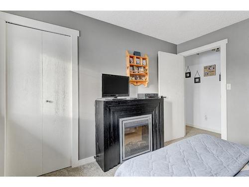 821050 Hwy 732, Rural Fairview No. 136, M.D. Of, AB - Indoor Photo Showing Bedroom With Fireplace