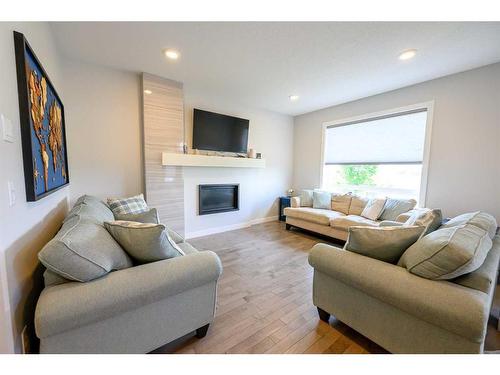 8518 71A Avenue, Grande Prairie, AB - Indoor Photo Showing Living Room With Fireplace