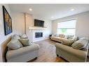 8518 71A Avenue, Grande Prairie, AB  - Indoor Photo Showing Living Room With Fireplace 