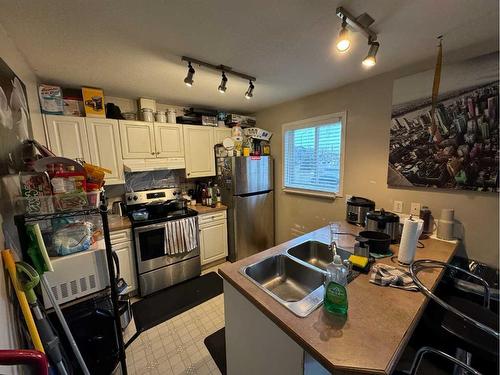 108-10150 121 Avenue, Grande Prairie, AB - Indoor Photo Showing Kitchen With Double Sink