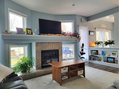 8542 69 Avenue, Grande Prairie, AB - Indoor Photo Showing Living Room With Fireplace