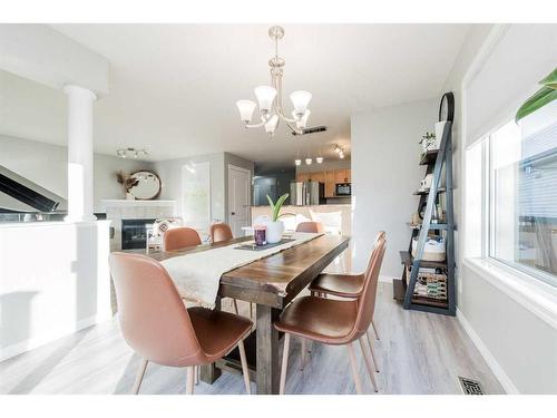 8709 65 Avenue, Grande Prairie, AB - Indoor Photo Showing Dining Room With Fireplace