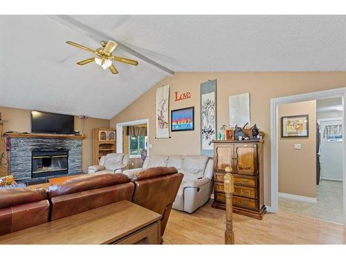 715060 Range Road 64,, Grande Prairie, AB - Indoor Photo Showing Living Room With Fireplace