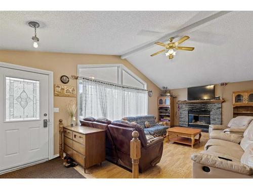 715060 Range Road 64, Grande Prairie, AB - Indoor Photo Showing Living Room With Fireplace