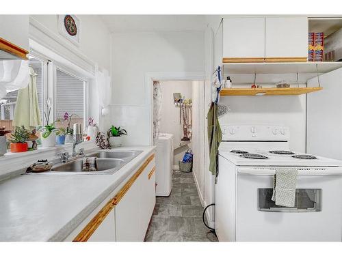 9808 108 Avenue, Grande Prairie, AB - Indoor Photo Showing Kitchen With Double Sink