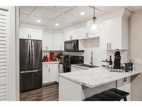 12014 103B Street, Grande Prairie, AB - Indoor Photo Showing Kitchen With Double Sink