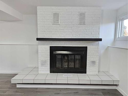 7610 Patterson Drive, Grande Prairie, AB - Indoor Photo Showing Living Room With Fireplace