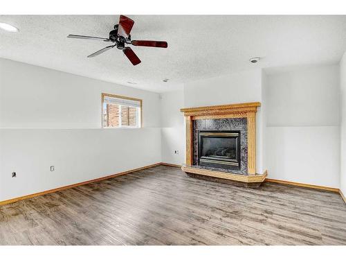 8883 108 Avenue, Grande Prairie, AB - Indoor Photo Showing Living Room With Fireplace