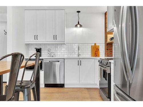 103-9810 96 Street, Grande Prairie, AB - Indoor Photo Showing Kitchen With Stainless Steel Kitchen With Upgraded Kitchen