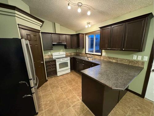 11213 69 Avenue, Grande Prairie, AB - Indoor Photo Showing Kitchen With Double Sink