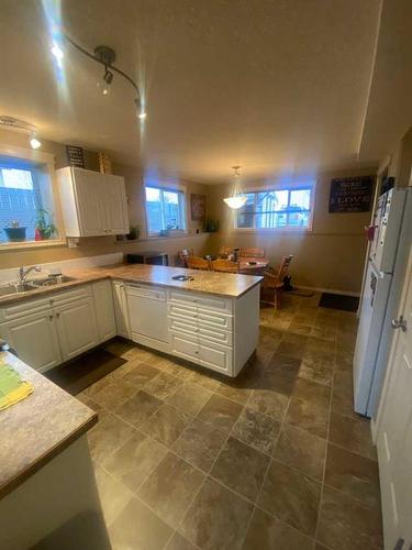 10313 Kateri Drive, Grande Prairie, AB - Indoor Photo Showing Kitchen With Double Sink