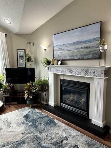 12409 107A Street, Grande Prairie, AB - Indoor Photo Showing Living Room With Fireplace