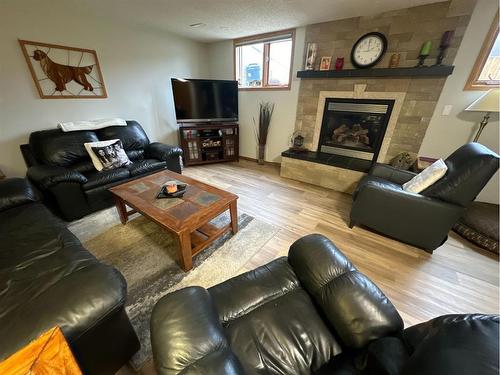 7129 99A Street, Peace River, AB - Indoor Photo Showing Living Room With Fireplace