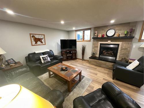 7129 99A Street, Peace River, AB - Indoor Photo Showing Living Room With Fireplace