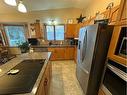 7129 99A Street, Peace River, AB  - Indoor Photo Showing Kitchen With Double Sink 