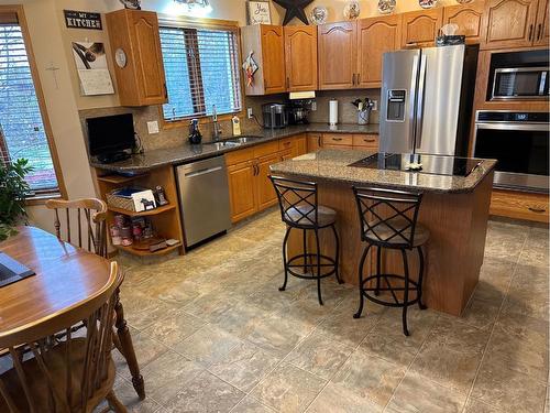 7129 99A Street, Peace River, AB - Indoor Photo Showing Kitchen With Double Sink