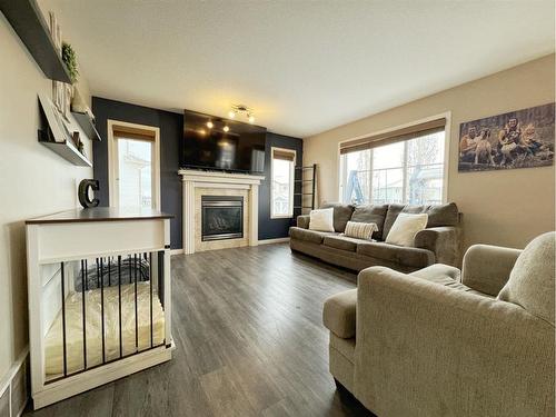 34 Pinnacle Point, Grande Prairie, AB - Indoor Photo Showing Living Room With Fireplace