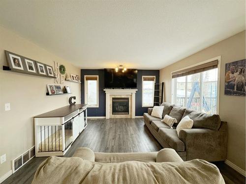 34 Pinnacle Point, Grande Prairie, AB - Indoor Photo Showing Living Room With Fireplace