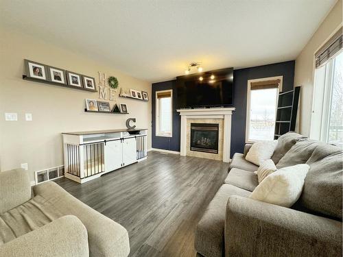 34 Pinnacle Point, Grande Prairie, AB - Indoor Photo Showing Living Room With Fireplace