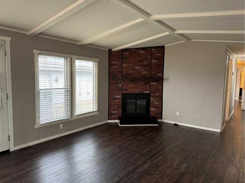 9738 120 Avenue, Grande Prairie, AB - Indoor Photo Showing Living Room With Fireplace