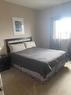 404-9221 Lakeland Drive, Grande Prairie, AB  - Indoor Photo Showing Bedroom 