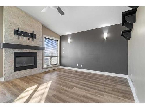 8625 62 Avenue, Grande Prairie, AB - Indoor Photo Showing Living Room With Fireplace