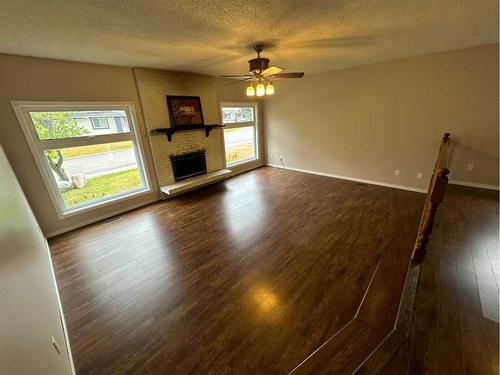 7719 95 Street, Grande Prairie, AB - Indoor Photo Showing Other Room With Fireplace