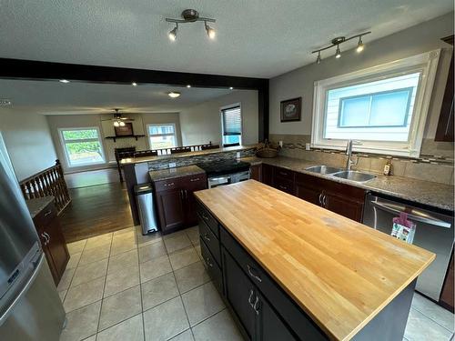 7719 95 Street, Grande Prairie, AB - Indoor Photo Showing Kitchen With Double Sink